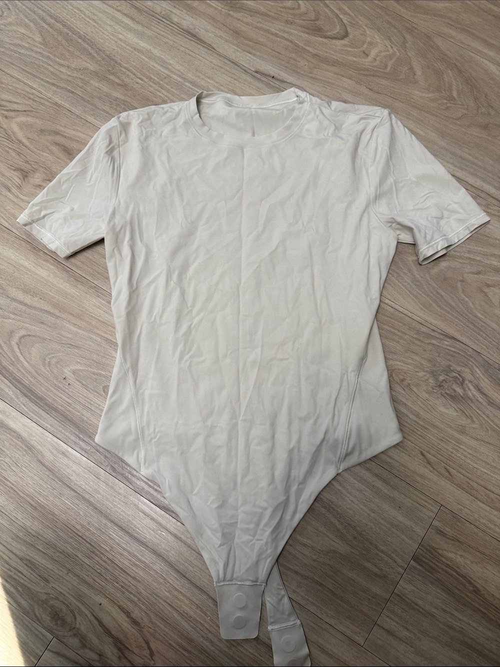 Lululemon Nulu Short Sleeve Snap-Button thing Bodysuit in bone (size M)